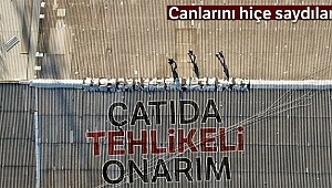 İş yeri çatısında tehlikeli onarım