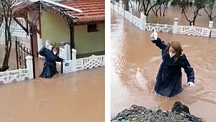 Sağlık çalışanı beline kadar gelen suyu aşıp hastasına müdahale etti