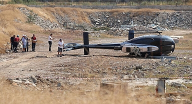 İzmir'de arızalanan helikopter boş araziye indiği sırada yan yattı