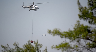 İzmir'de kontrol altına alınan yangında soğutma çalışmaları sürüyor